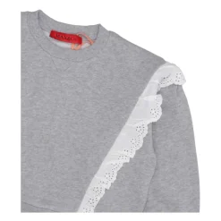 Jersey gris claro con volantes