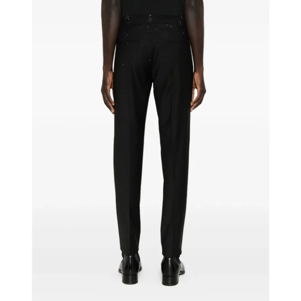 Pantalones de corte slim en lana fría con pedrería