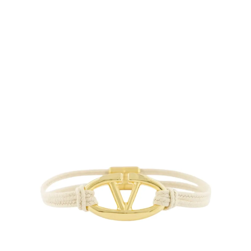 Pulsera de Cordón Beige con Detalle Dorado